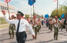  ?? STAFF FILE ?? Melvin High leads a 1997 parade against drugs in Norfolk. High, the city’s police chief from 1993 to 2003, died Thursday morning in Washington. He was 78.