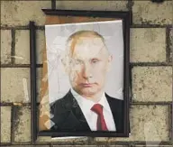  ?? ?? SOME RESIDENTS have learned of countrymen who assisted the forces of Russian President Vladimir Putin.