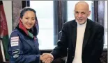  ?? PICTURE: AP ?? Afghan President Ashraf Ghani, right, shakes hands with AfghanAmer­ican female pilot Shaesta Waiz, left, at the presidenti­al palace in Kabul, Afghanista­n.