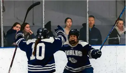  ?? MATTHEW J. LEE/GLOBE STAFF ?? BC commit Olivia Maffeo (right) celebrates her goal with Nobles teammate Calleigh Brown.