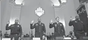  ?? ANDREW HARNIK, POOL/AFP VIA GETTY ?? From the left, U.S. Capitol Police Sgt. Aquilino Gonell, DC Metropolit­an Police Department Officer Michael Fanone, DC Metropolit­an Police Department Officer Daniel Hodges and U.S. Capitol Police Private First Class Harry Dunn, are sworn in before the Select Committee in 2021.