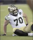  ?? AP file photo ?? Mitchell Loewen of the New Orleans Saints sits on the field after suffering an injury during a preseason game against the Jacksonvil­le Jaguars in August 2018.