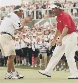  ??  ?? 0 Westwood celebrates with caddie Billy Foster after his 2009 Dubai win