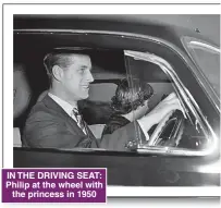  ??  ?? IN THE DRIVING SEAT: Philip at the wheel with the princess in 1950