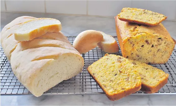  ??  ?? Rustic French-style bread, left, and cornbread, the latter rich with herbs, cheese and onions.