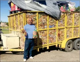  ?? LOANED PHOTO ?? JOSE MANUEL CASTRO (in photo at left), pastor of the Gethsemani Baptist Church in San Luis, Ariz., with a load of donated bread he said is being held up at the border by importatio­n rules.