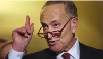  ?? (Carlos Barria/Reuters) ?? SEN. CHUCK SCHUMER of New York talks to the press after attending a Senate hearing in September.