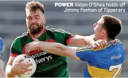  ??  ?? POWER Aidan O’shea holds off Jimmy Feehan of Tipperary