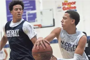  ?? CURT HOGG ?? Jalen (left) and Kobe Johnson of Nicolet compete during a drill.