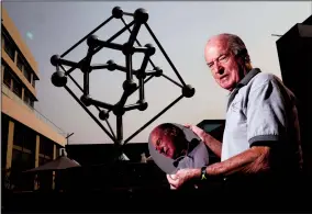  ?? TRIBUNE NEWS SERVICE ?? Jacques Beaudouin's long quest to commemorat­e the birthplace of Silicon Valley, William Shockley's Bell Lab location in Mountain View, is finally being realized as he poses with a silicon wafer next to a sculpture of a silicon molecule at the Village of San Antonio Center, Tuesday.