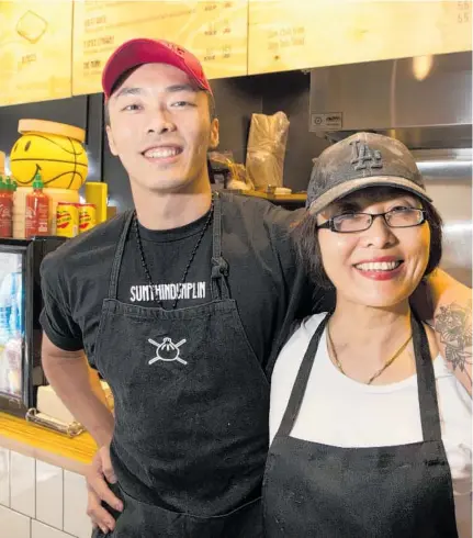  ?? Photo / Brett Phibbs ?? Sumthin Dumplin in O'Connell St is a family operation. Pictured are mother and son, Shane Liu and Lan Ni.