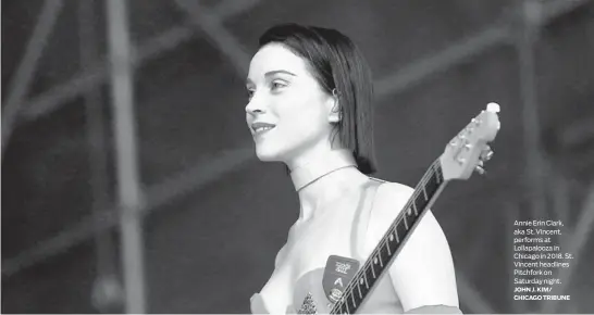  ?? JOHN J. KIM/ CHICAGO TRIBUNE ?? Annie Erin Clark, aka St. Vincent, performs at Lollapaloo­za in Chicago in 2018. St. Vincent headlines Pitchfork on Saturday night.