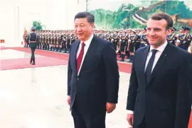  ?? Picture: AFP ?? ALL SMILES. French President Emmanuel Macron and Chinese President Xi Jinping during a welcome ceremony in Beijing yesterday.
