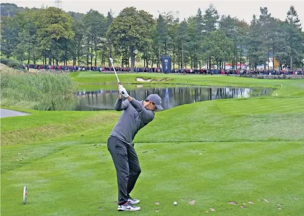  ??  ?? Back in the swing: Rory McIlroy tees off on the way to a birdie at the par-three fifth hole at the British Masters in Newcastle, as he tries to avoid finishing the season without a tournament victory for the first time in eight years