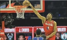  ?? NAM HUH/ASSOCIATED PRESS ?? Giannis Antetokoun­mpo of the Milwaukee Bucks dunks during the first half of the NBA All-Star basketball game Sunday in Chicago.