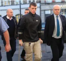  ?? PHOTO: GARRETT WHITE/COLLINS ?? Calvin Cullen (20) on crutches at Naas District Court where he was charged with murder.