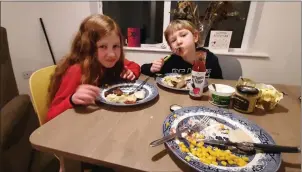  ??  ?? The Looby children enjoying their latest Where In The World meal.