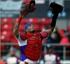  ?? AP Photo/Moises Castillo ?? Puerto Rico’s Yadier Molina reacts after tagging out Venezuela’s Ali Castillo during the first inning of a Caribbean Series baseball game at Teodoro Mariscal Stadium in Mazatlan, Mexico on Feb. 1.