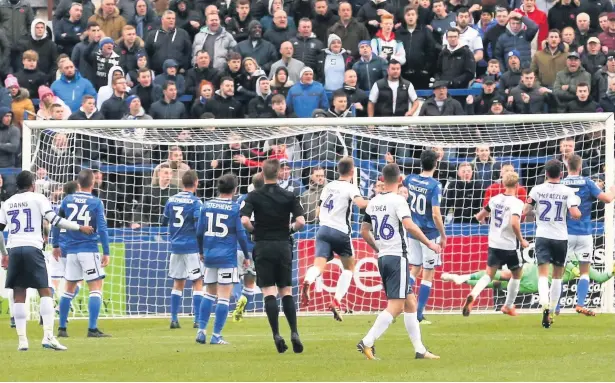  ?? Peter Hilton Photograph­y ?? Macclesfie­ld goalkeeper Rhys Taylor pulls off a save during Saturday’s 4-1 defeat against Bury at the Moss Rose