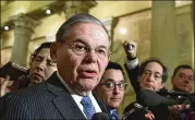  ?? SUSAN WALSH / AP ?? Sen. Bob Menendez, D-N.J., speaks with reporters on Capitol Hill in Washington on Wednesday following a meeting with the Congressio­nal Hispanic Caucus and White House chief of staff John Kelly.