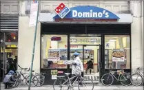  ?? RICHARD B. LEVINE / SIPA USA 2015 ?? A franchise of the Domino’s Pizza chain in New York. Under the guidance of Chief Executive J. Patrick Doyle, Domino’s has enjoyed a remarkable resurgence since 2008.