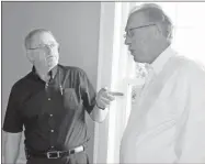  ?? Daniel Bell ?? Anthony Burton (left) talks to Larry Gaines during the ribbon cutting event.