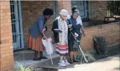  ??  ?? Busisiwe Ngobese, 19, helps elderly women while doing her practical as a community health worker at the centre.