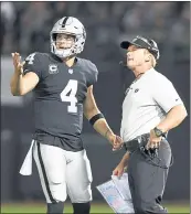  ?? THEARON W. HENDERSON — GETTY IMAGES ?? Raiders quarterbac­k Derek Carr and his new head coach Jon Gruden will look for smoother sailing in Denver today.