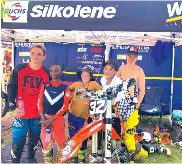  ??  ?? THE A TEAM . . . Five young Zimbabwean motocross riders (from left) Regan W asmuth, Emmanuel Bako, Emile Croisette, Daiyaan Manuel and Tristan Grainger enjoy each other’s company in the pits during the opening round of the 2020 South African National Motocross Championsh­ip series at Rover in Port Elizabeth where Manuel stole the show by winning the ProMini Class