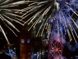  ?? REUTERS ?? LONDON Fireworks explode around the London Eye wheel, the Big Ben clock tower and the Houses of Parliament to mark the beginning of the New Year in London on Jan. 1.