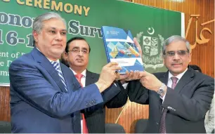  ?? APP ?? Pakistani Finance Minister Senator Ishaq Dar presenting the Pakistan Economic Survey for fiscal year 2016-17 at a Press conference in Islamabad on Thursday. —