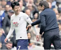  ?? ?? Full approval: Antonio Conte, the Spurs head coach, congratula­tes Son Heung-min after his two goals against Leicester City last Sunday