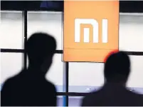  ?? AGENCE FRANCE-PRESSE/GETTY IMAGES ?? It was reported that Xiaomi is looking to raise about $10 billion and is aiming for a market valuation of $70 billion to $80 billion.