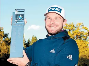  ??  ?? Tyrrell Hatton holds aloft the BMW PGA Championsh­ip trophy. Credit: Getty Images