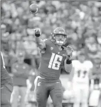  ?? The Associated Press ?? BIG ARM: Washington State quarterbac­k Gardner Minshew II throws a pass on Saturday during the first half of the Cougars’ 5924 victory against Eastern Washington in Pullman, Wash.