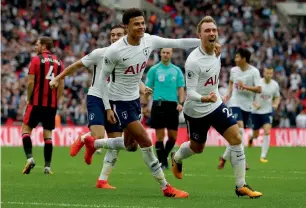  ?? AFP ?? Christian Eriksen (right) celebrates with Dele Alli after scoring the winner against Bournemout­h. —