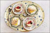  ?? PHOTO FOR THE WASHINGTON POST BY DEB LINDSEY ?? Desserts on flowery china plates and a vintage platter at Elle in Washington, D.C.