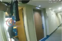  ?? DEPARTMENT FORT LAUDERDALE POLICE ?? Karl Chludinsky is shown in footage from an officer’s body-worn camera video holding a gun and lowering it toward the group of officers in the hotel.