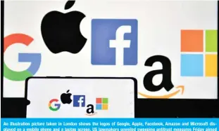  ?? AFP ?? An illustrati­on picture taken in London shows the logos of Google, Apple, Facebook, Amazon and Microsoft displayed on a mobile phone and a laptop screen. US lawmakers unveiled sweeping antitrust measures Friday aimed at tempering the dominance of Big Tech firms. —