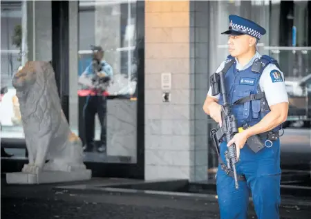  ?? Photo / Jason Oxenham ?? An armed policeman stood guard outside the Sofitel Hotel after responding to Thursday’s shooting.