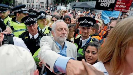  ?? PHOTO: REUTERS ?? Britain’s opposition Labour Party leader, Jeremy Corbyn, greets people at an anti-austerity rally in central London early in July.