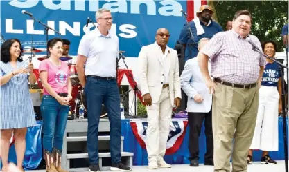  ?? MITCHELL ARMENTROUT/SUN-TIMES ?? Gov. JB Pritzker speaks Wednesday at the Illinois State Fair alongside other statewide elected Democrats.