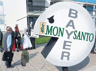  ?? PATRIK STOLLARZ AGENCE FRANCE-PRESSE ?? Bayer’s $63 billion acquisitio­n of Monsanto sparked protests at the company’s annual meeting in Bonn, Germany last May.