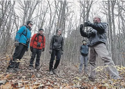  ?? CLIFFORD SKARSTEDT EXAMINER ?? Local ecologist Bill Crins, a professor of protected area ecology and management at the University of Toronto, leads a tour of a wooded property on Tuesday that Kawartha Land Trust is trying to secure near Kawartha Park Road south of Burleigh Falls.