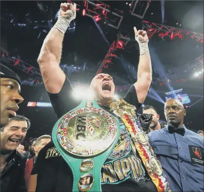  ?? PICTURE: MIKEY WILLIAMS/TOP RANK ?? TOP OF THE WORLD: Tyson Fury celebrates his victory over Deontay Wilder in Las Vegas on Saturday night.