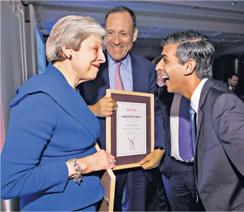  ?? ?? Theresa May and Rishi Sunak at the Spectator Parliament­arian of the Year awards. Mr Sunak won for comeback of the year, while Mrs May was honoured for best speech