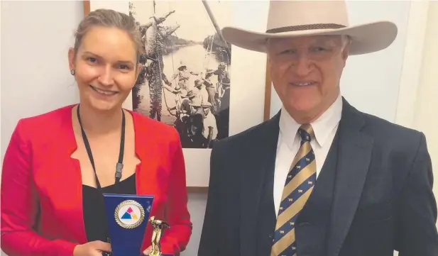  ??  ?? ENDURANCE TEST: Anne Pleash with Bob Katter after she completed the 9km National Capital Swim which involved swimming the length of Lake Burley Griffin in Canberra.