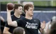  ?? DAVID J. PHILLIP — THE ASSOCIATED PRESS ?? NFL Draft prospect Southern California quarterbac­k Sam Darnold throws a pass to participan­ts in a Play Football Clinic Wednesday in Arlington, Texas. The 2018 NFL Draft begins Thursday at AT&T Stadium.