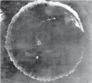  ?? AP Photo/U.S. Army ?? ■ This June 1942 file photo shows an aerial view of a Japanese carrier maneuverin­g in a complete circle in an effort to escape in the Midway Islands, Hawaii. After the battle, the Army reported repeated bomb hits on the enemy carriers Kaga and Akagi, while the Navy, in listing results, said four enemy carriers were definitely sunk. A research vessel called the Petrel is launching underwater robots about halfway between the U.S. and Japan in search of warships from the Battle of Midway.