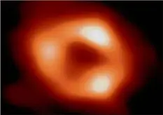  ?? EHT Collaborat­ion / TNS ?? This is the first image, and first direct visual evidence, of Sagittariu­s A* (pronounced “Sagittariu­s A-star”), the supermassi­ve black hole at the center of our galaxy. It was captured by the Event Horizon Telescope, an array which linked together eight existing radio observator­ies across the planet to form a single “Earth-sized” virtual telescope.